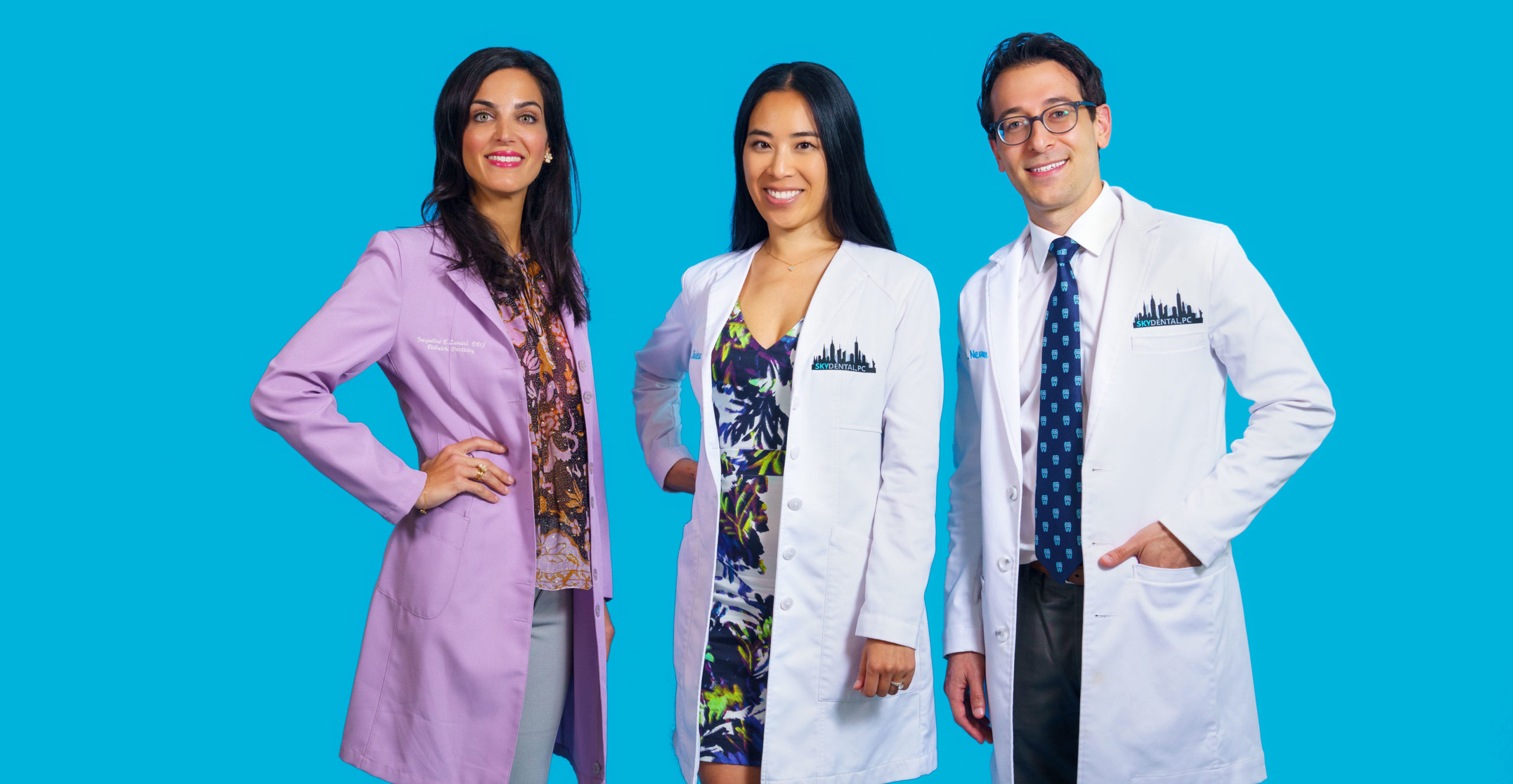 Sky Dental Dentists against a sky-blue background. Left to right: Dr. Jacqueline Zamani, Dr. Wonnie Rhieu, and Dr. Ross Newman. They are here for all your preventive visits!
